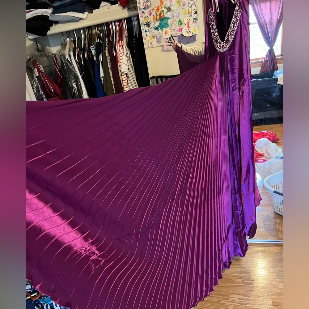 Floor length purple gown with train